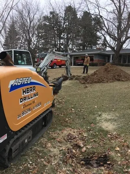 Herr Well Drilling crew drilling a new residential well in a homeowner’s yard in Waukesha, WI